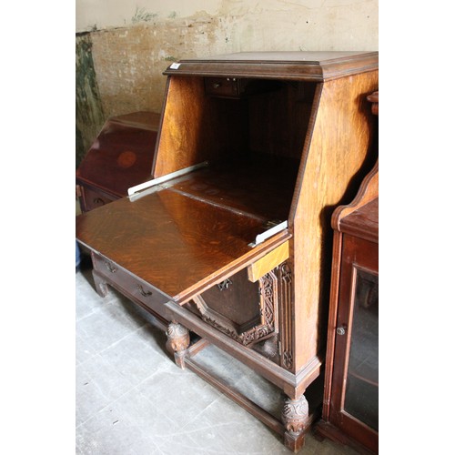 19 - A small early 20th century carved oak bureau, 61cm wide, and an Edwardian inlaid mahogany bureau, 70... 