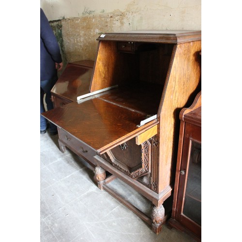 19 - A small early 20th century carved oak bureau, 61cm wide, and an Edwardian inlaid mahogany bureau, 70... 