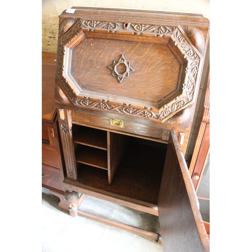 19 - A small early 20th century carved oak bureau, 61cm wide, and an Edwardian inlaid mahogany bureau, 70... 