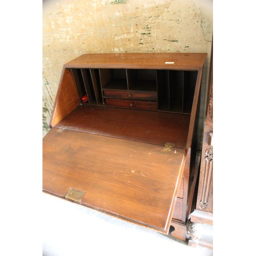 19 - A small early 20th century carved oak bureau, 61cm wide, and an Edwardian inlaid mahogany bureau, 70... 