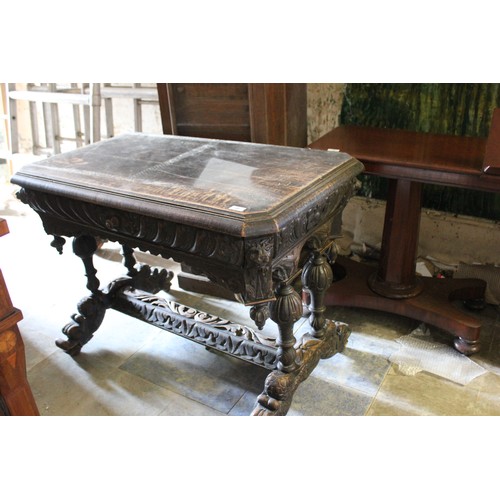 21 - A late 19th/early 20th century carved oak side table of Flemish revival style.