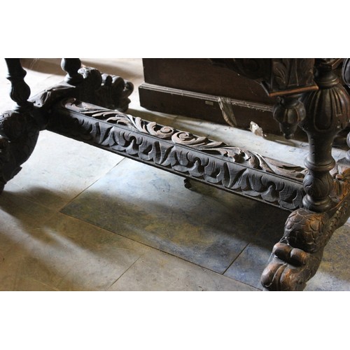 21 - A late 19th/early 20th century carved oak side table of Flemish revival style.