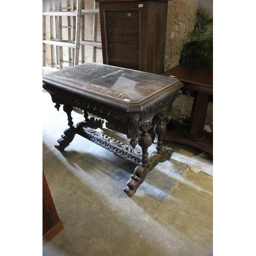 21 - A late 19th/early 20th century carved oak side table of Flemish revival style.