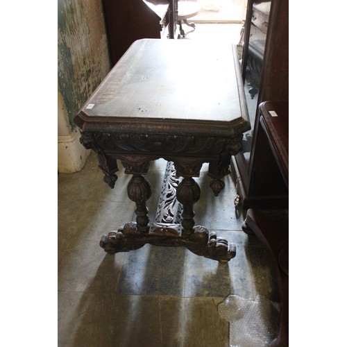 21 - A late 19th/early 20th century carved oak side table of Flemish revival style.