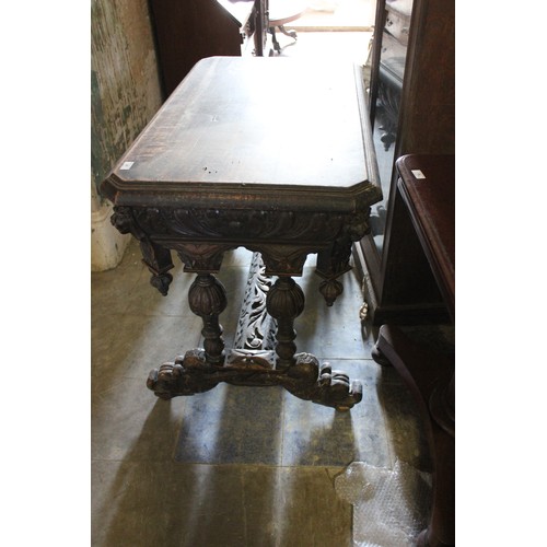 21 - A late 19th/early 20th century carved oak side table of Flemish revival style.