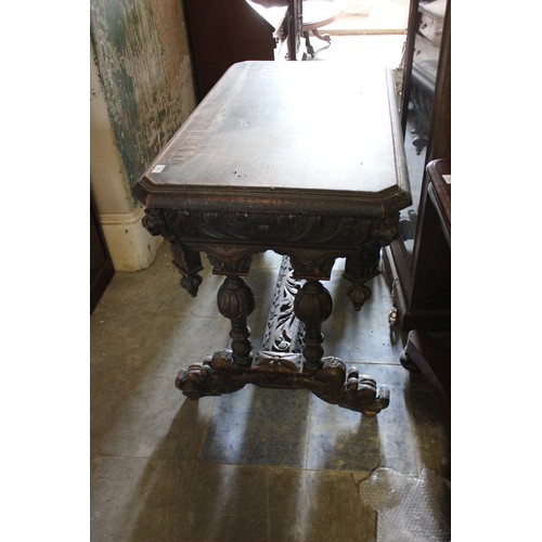 21 - A late 19th/early 20th century carved oak side table of Flemish revival style.