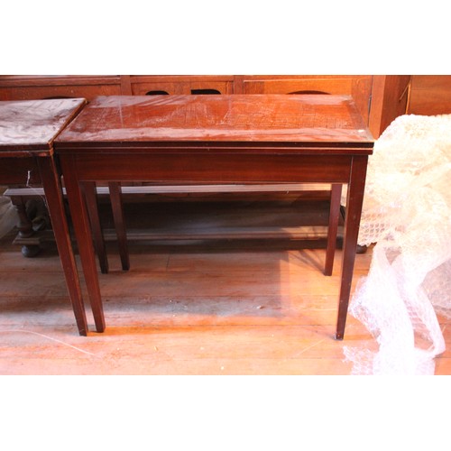 26 - A pair of 20th century mahogany card tables, on tapering legs, 91cm wide. (2)