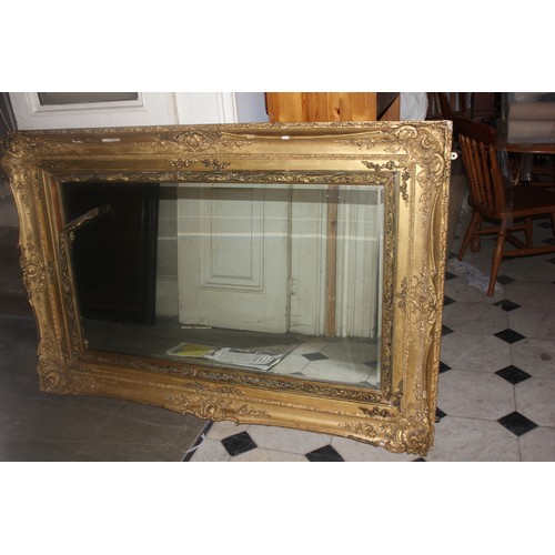 40 - A large wall mirror in gilt picture-type frame, 101cm x 151cm.