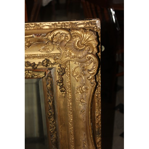 40 - A large wall mirror in gilt picture-type frame, 101cm x 151cm.