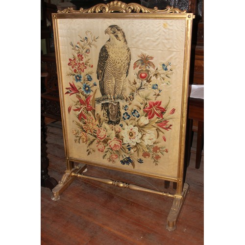 43 - An oak and marquetry inlaid tray, 72cm wide, a fire screen and a further gilt fire screen with needl... 