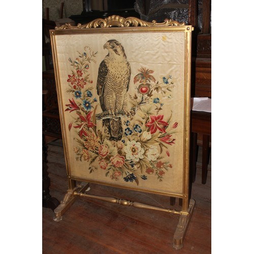 43 - An oak and marquetry inlaid tray, 72cm wide, a fire screen and a further gilt fire screen with needl... 