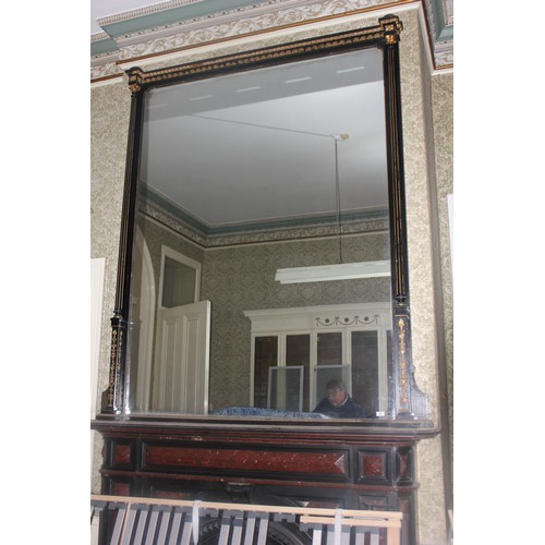 46 - A large ebonised and gilt-painted overmantel mirror, 179cm wide x approx. 260cm high.