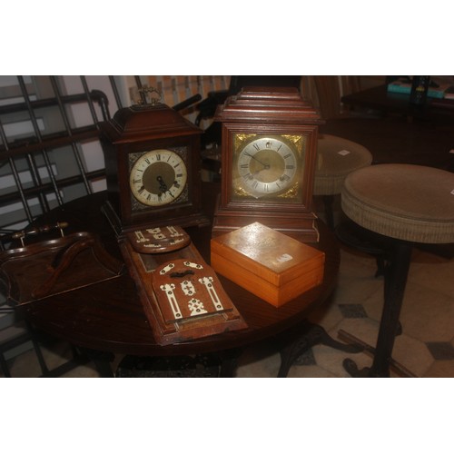 50 - An oak mantel clock, a late Victorian book rack, a crumb tray, a satin beech box, and a further cloc... 