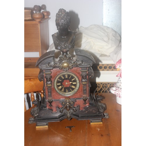 51 - A late 19th century marble French mantel clock with bronze base surrounded on the case, 60cm high.