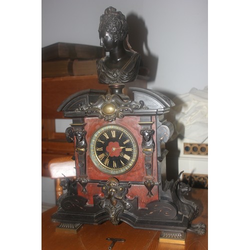 51 - A late 19th century marble French mantel clock with bronze base surrounded on the case, 60cm high.