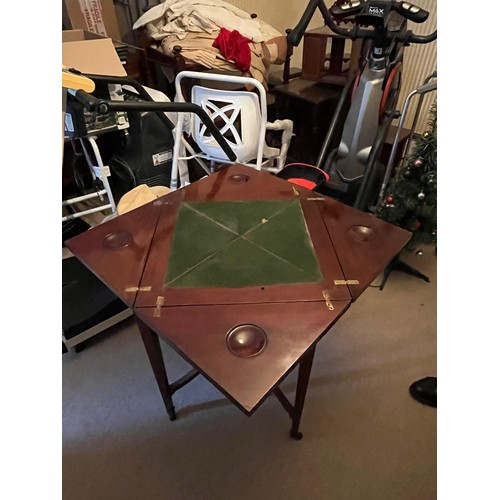 129 - An Edwardian envelope card table, on tapering legs, in need of restoration.