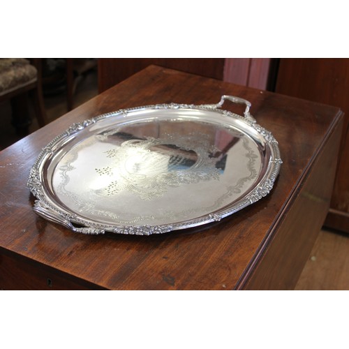 251 - A late Victorian large oval two-handled silver-plated tray inscribed 