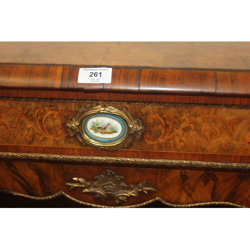 261 - A Victorian walnut credenza with gilt-metal mounts and oval porcelain medallion, the central glazed ... 