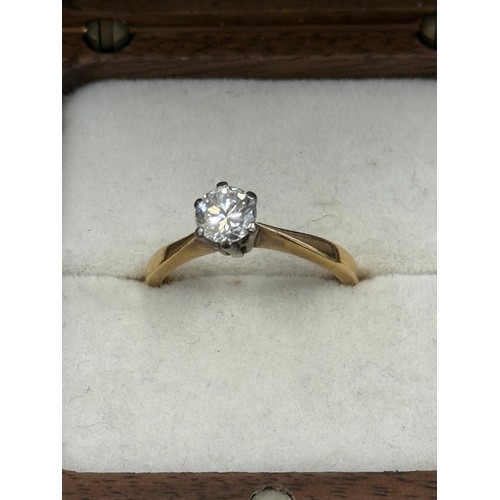 A diamond solitaire dress ring, unmarked, approx. .45 carats, and a ...
