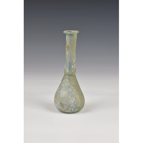 192 - A Roman iridescent glass unguentarium, 1st-2nd century AD, in pale blue-green glass, with flat, ever... 