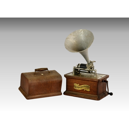 213 - An oak cased phonograph by ' The Columbia Graphophone ' company, having matched aluminium horn, the ... 