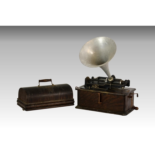 220 - An oak cased Edison Home phonograph, having matched aluminium horn, serial number 309920, 16¼in. (41... 