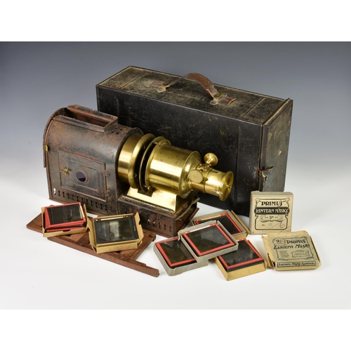 226 - A magic lantern slide projector and glass slides, the projector stamped 11 Moorgate St London, many ... 