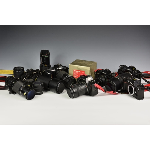 228 - A collection of Canon and Nikon film cameras and lenses, comprising of Canon - Macro lend FD 200mm 1... 