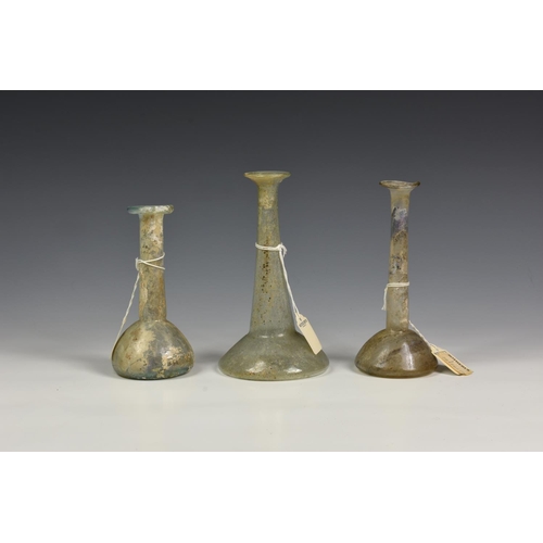 187 - Ancient Artifacts - Three unguentarium Roman glass vessels, circa 2nd ~ 3rd Century A.D., each havin... 