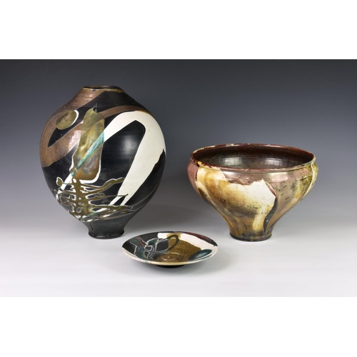 22 - A Canadian studio pottery wood fired vase by Larry Aguilar, with organic autumnal decoration, script... 