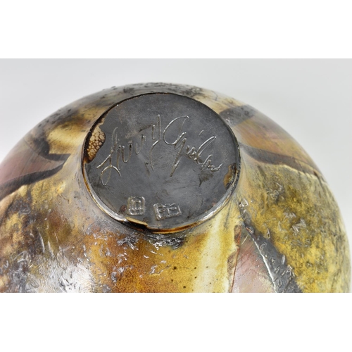 22 - A Canadian studio pottery wood fired vase by Larry Aguilar, with organic autumnal decoration, script... 