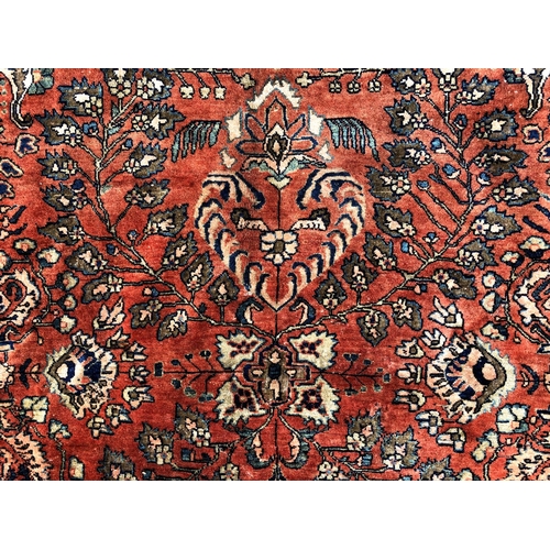 288 - An antique Persian carpet, probably 19th or early 20th century, with all over floral, vase and folia... 
