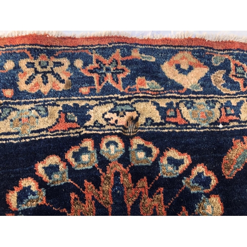 288 - An antique Persian carpet, probably 19th or early 20th century, with all over floral, vase and folia... 