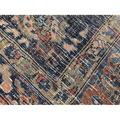 288 - An antique Persian carpet, probably 19th or early 20th century, with all over floral, vase and folia... 