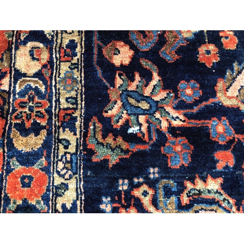 288 - An antique Persian carpet, probably 19th or early 20th century, with all over floral, vase and folia... 