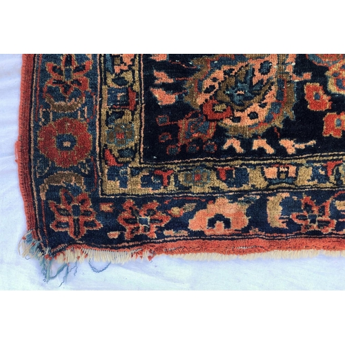 288 - An antique Persian carpet, probably 19th or early 20th century, with all over floral, vase and folia... 