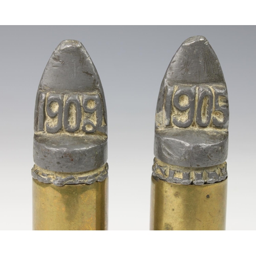 1009 - Trench Art - Two large calibre bullet shells , The lead tips carved 1902 & 1905, the bullets stampe... 