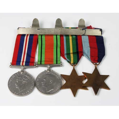 1011 - A WW2 four medal group, comprising 1939-1945 Star, Pacific Star, Defence medal and War medal, mounte... 