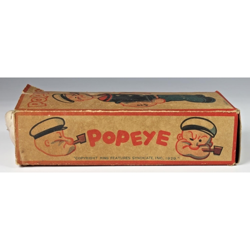 11 - A celluloid windup clockwork Popeye with original box, 'King Features Synd. 1929', damage to Popeye'... 