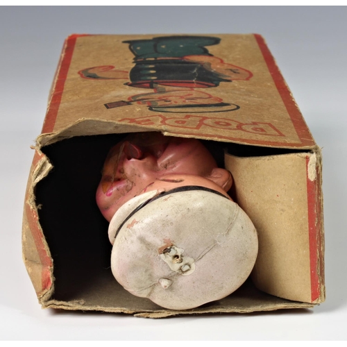 11 - A celluloid windup clockwork Popeye with original box, 'King Features Synd. 1929', damage to Popeye'... 
