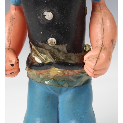 11 - A celluloid windup clockwork Popeye with original box, 'King Features Synd. 1929', damage to Popeye'... 