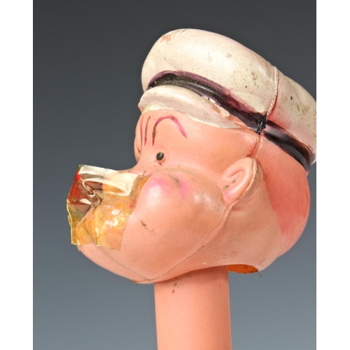 11 - A celluloid windup clockwork Popeye with original box, 'King Features Synd. 1929', damage to Popeye'... 
