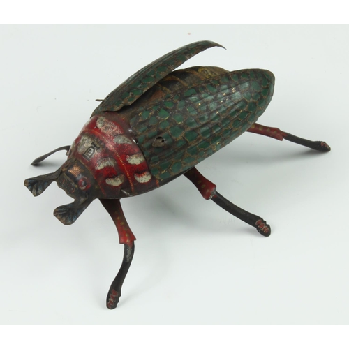 121 - A Lehmann tinplate clockwork beetle, c.1885, having moving legs and wings (working), together with a... 