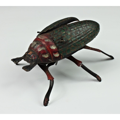 121 - A Lehmann tinplate clockwork beetle, c.1885, having moving legs and wings (working), together with a... 