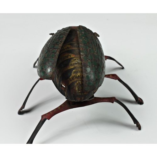 121 - A Lehmann tinplate clockwork beetle, c.1885, having moving legs and wings (working), together with a... 