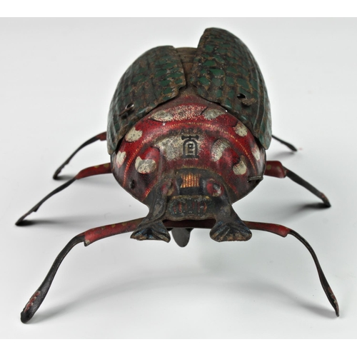 121 - A Lehmann tinplate clockwork beetle, c.1885, having moving legs and wings (working), together with a... 