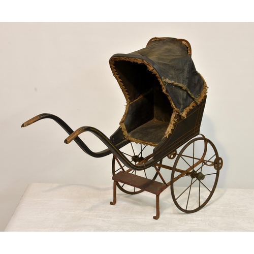 145 - A late 19th to early 20th century doll stroller rickshaw pram, of wooden and metal construction with... 