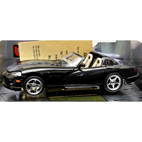 7 - A collection of four 1/18 scale precision diecast boxed model cars by Bburago, Gold Collection - com... 