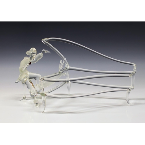 305 - A glass figure of a pianist at a grand piano, unknown manufacture, probably Murano, the pianist with... 