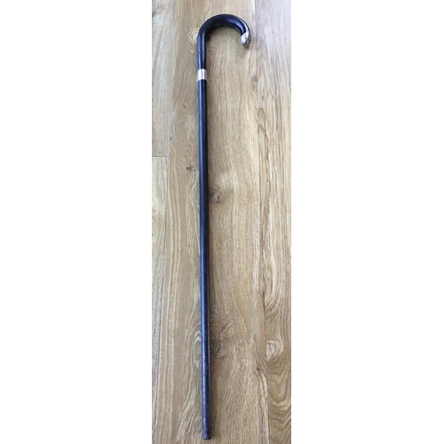 313 - A vintage ebony walking stick with silver collar and handle tip, London, 1932, 33½in. (85.5cm.) long... 